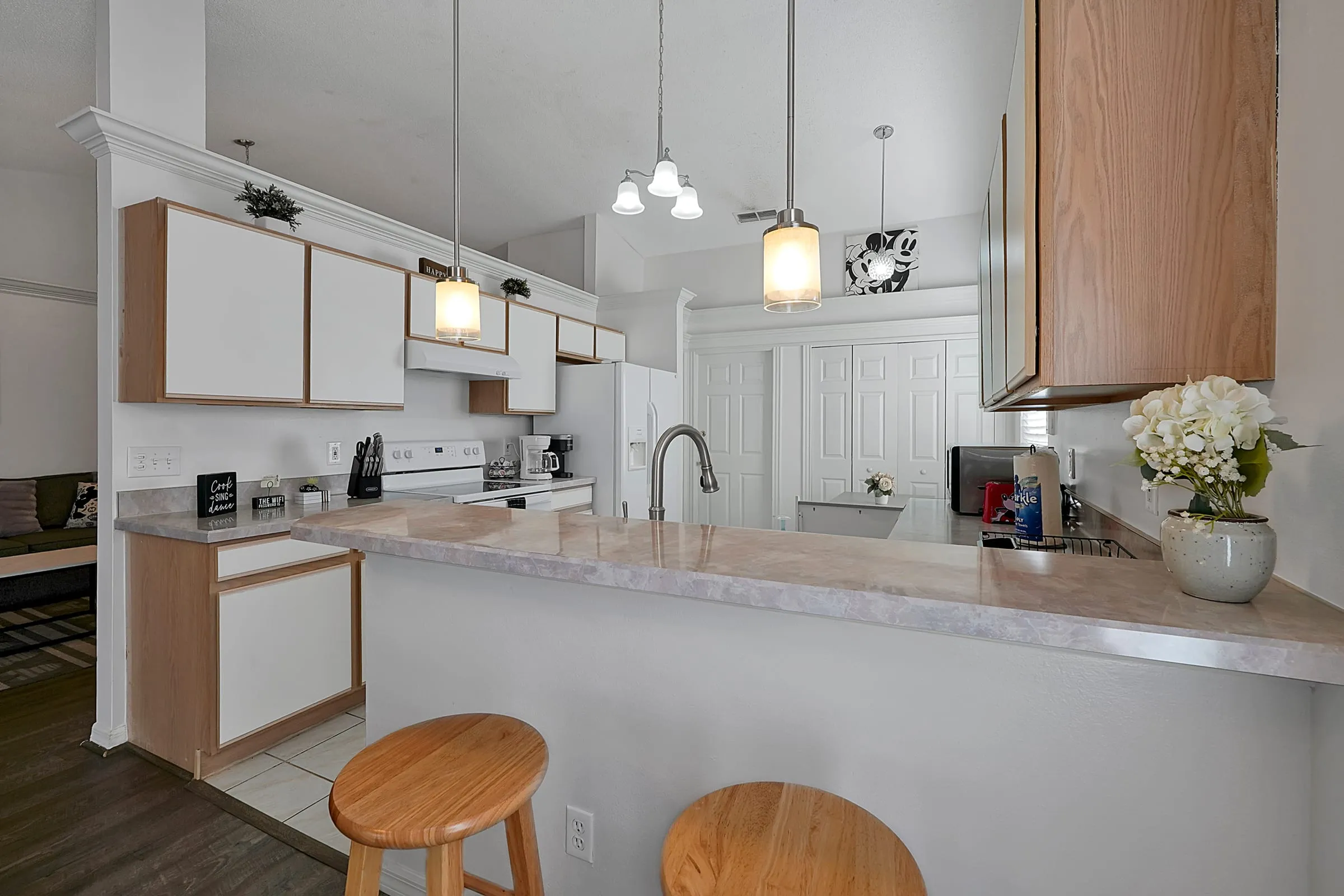 Wide view of the kitchen island and bar seating