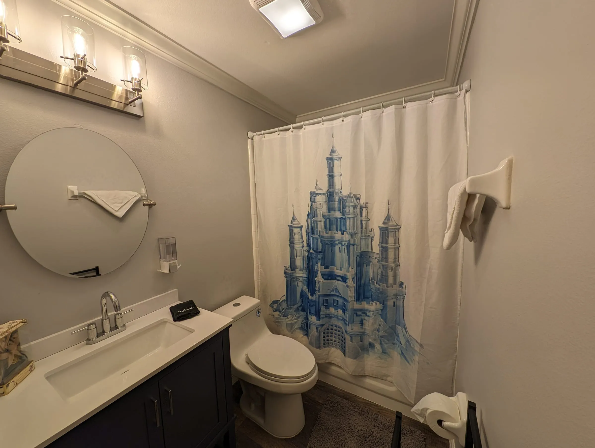 Wide view of the themed shared bathroom