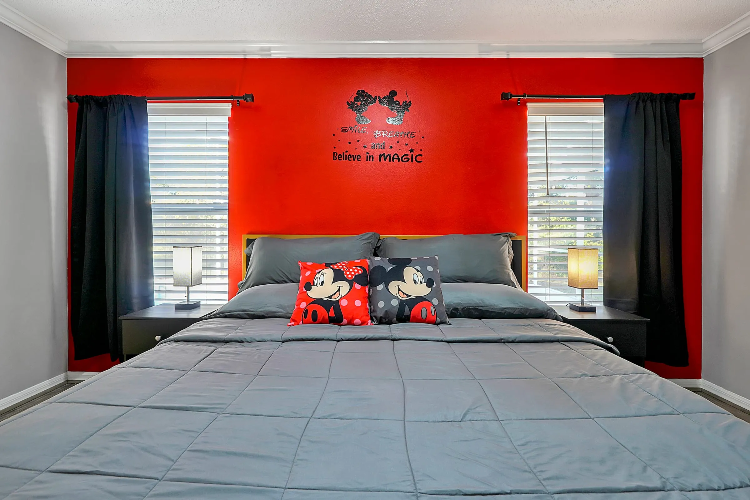 Centered view of the master king bed and accent wall