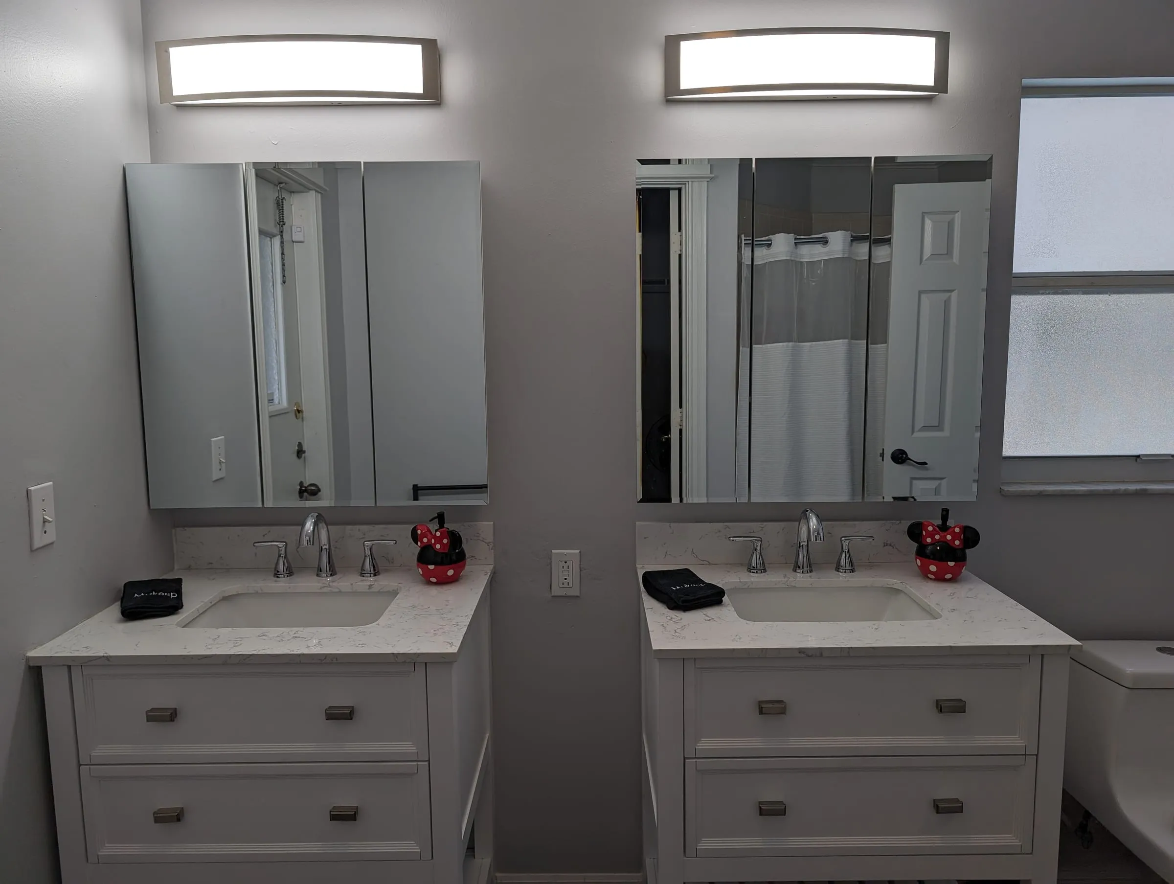 Second vanity angle showing the mirror cabinets