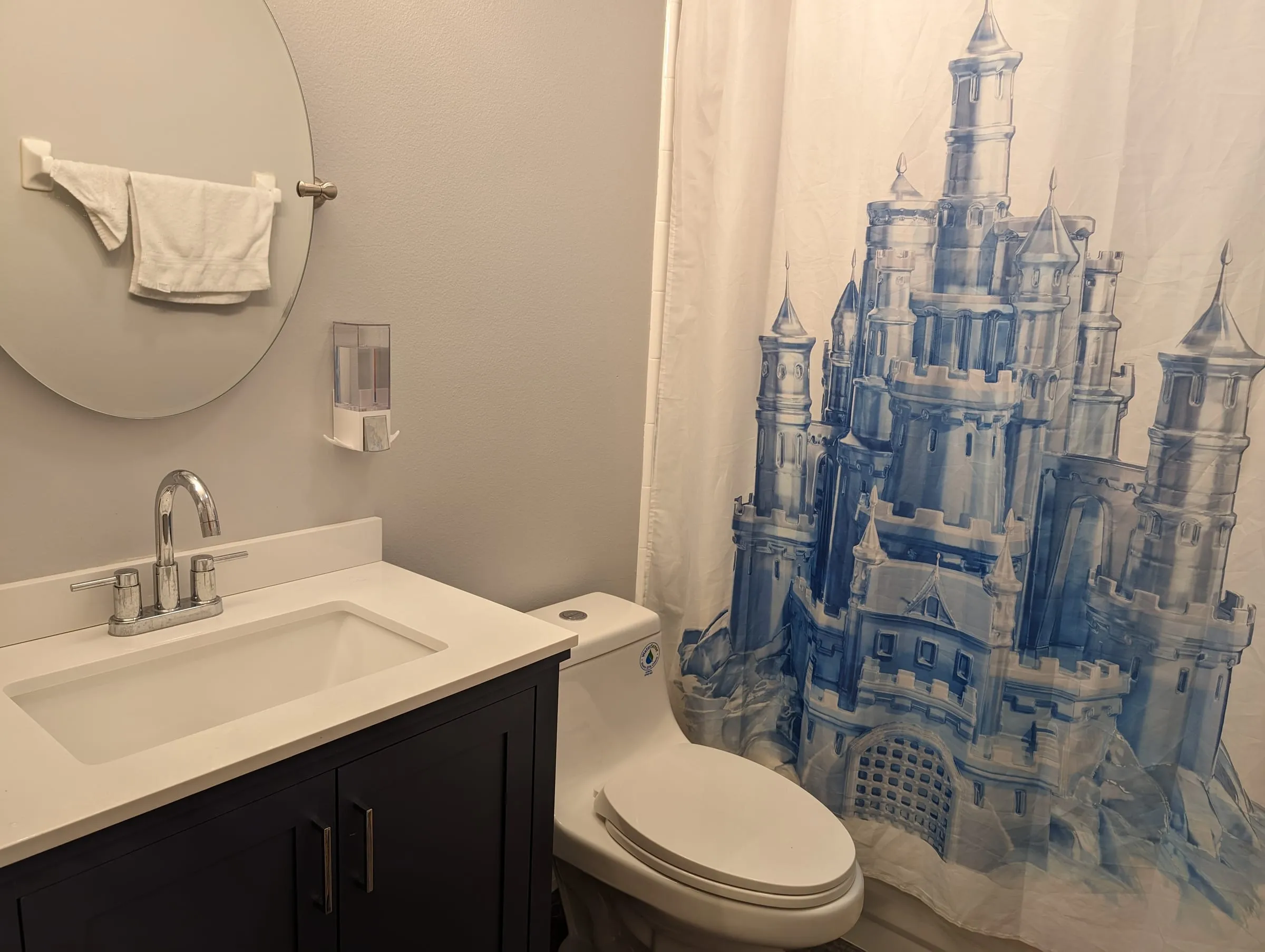 Clean vanity and shower curtain detail