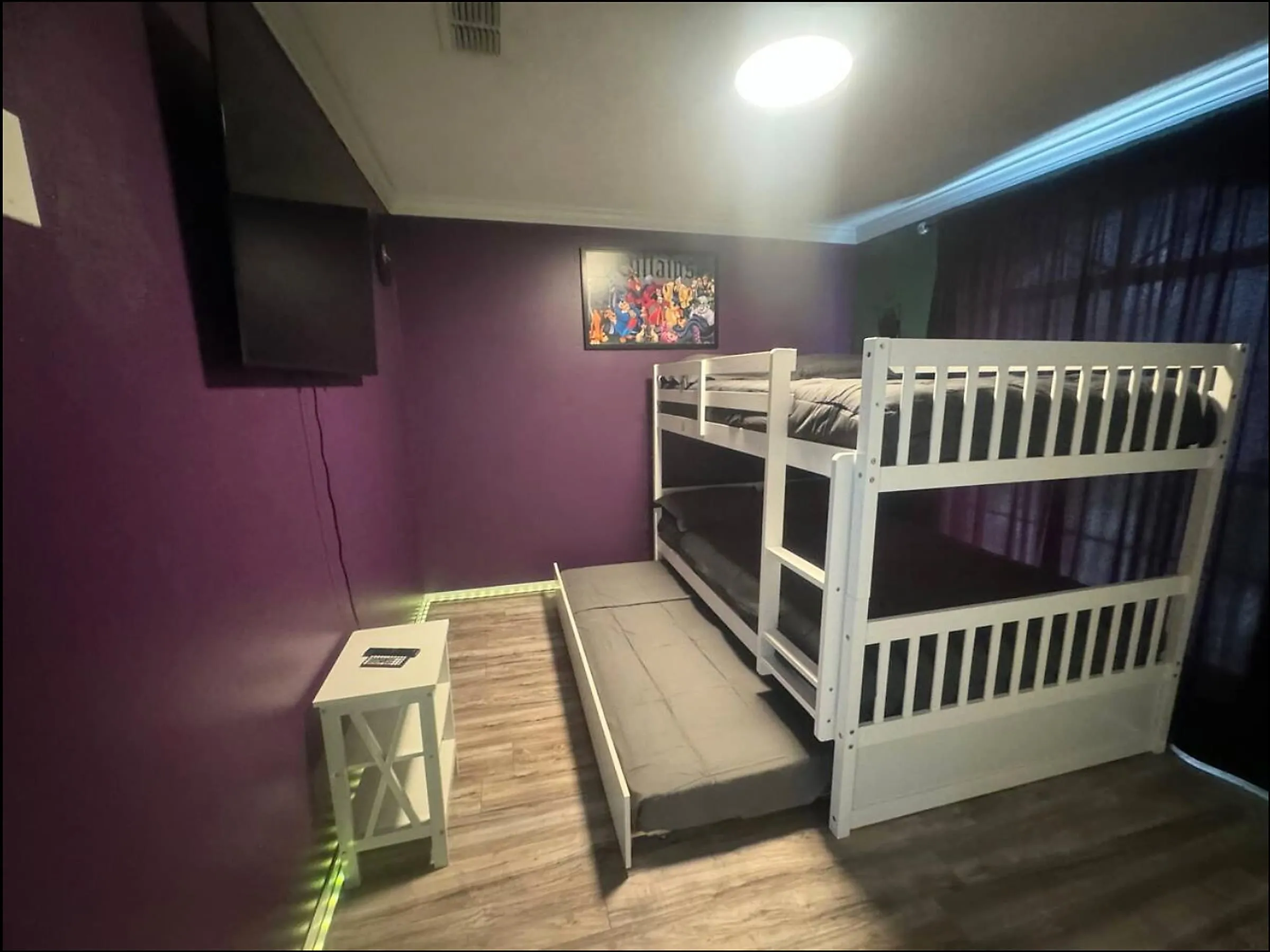 Daytime wide showing the purple and green color block and sofa