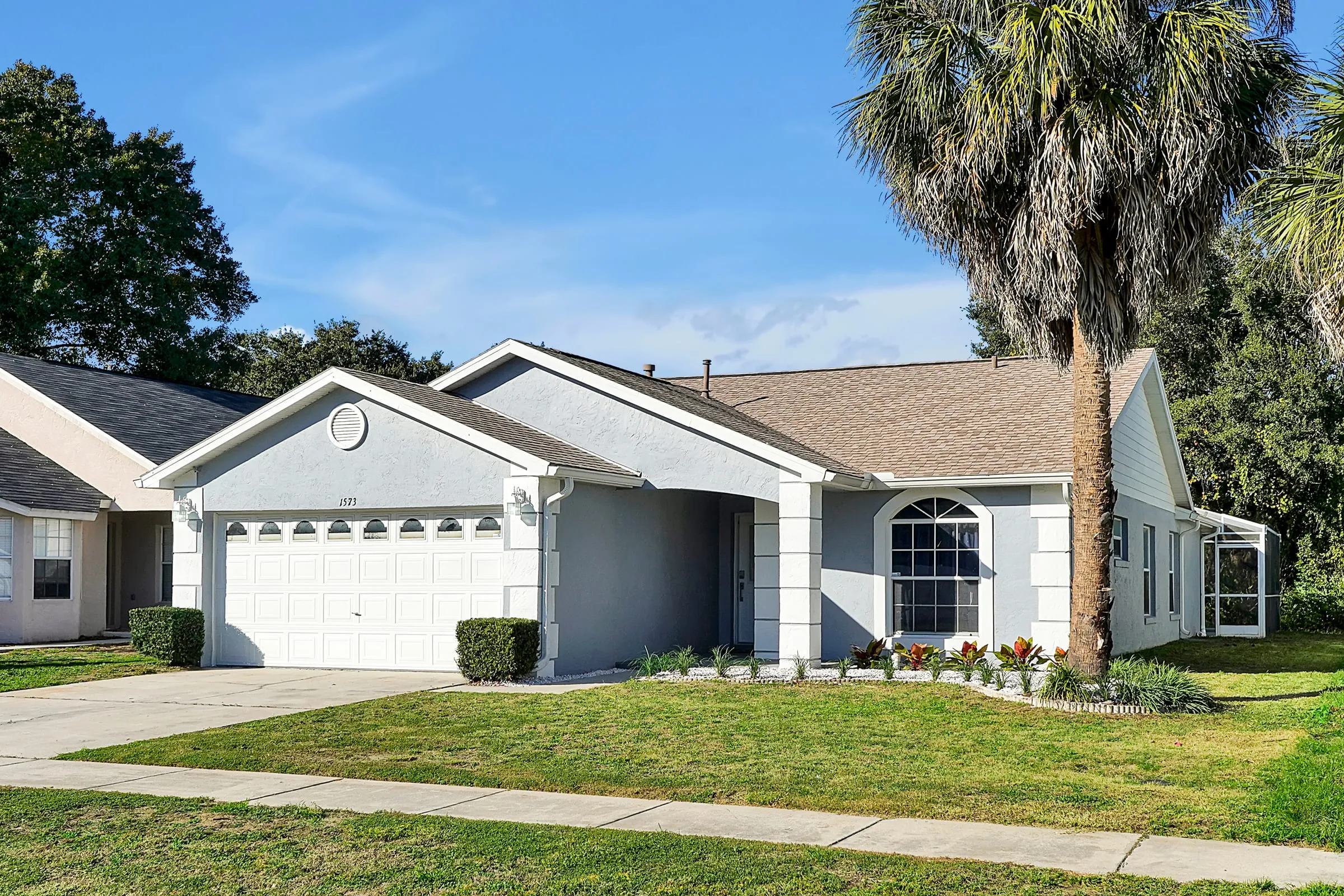 Daytime side view of the home and driveway