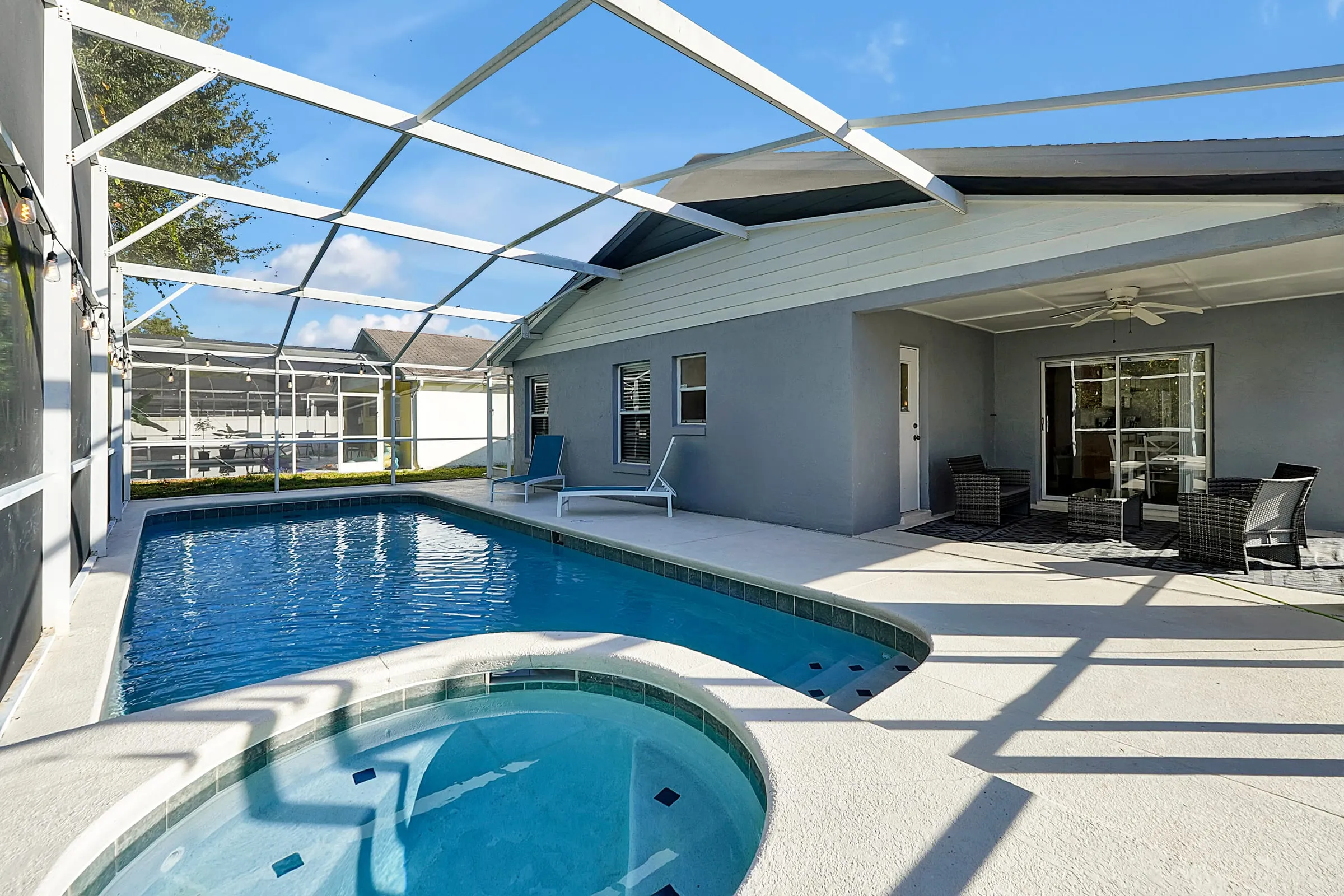 Daytime view of the pool and spa from the lanai