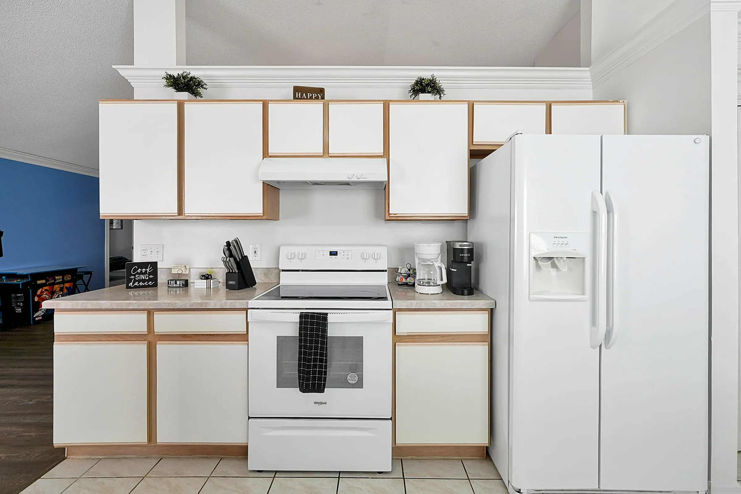 Appliance wall with full-size fridge and double oven